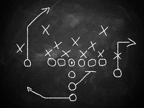 Chalkboard diagram showing football play strategy symbolizing a digital marketing strategy plan.